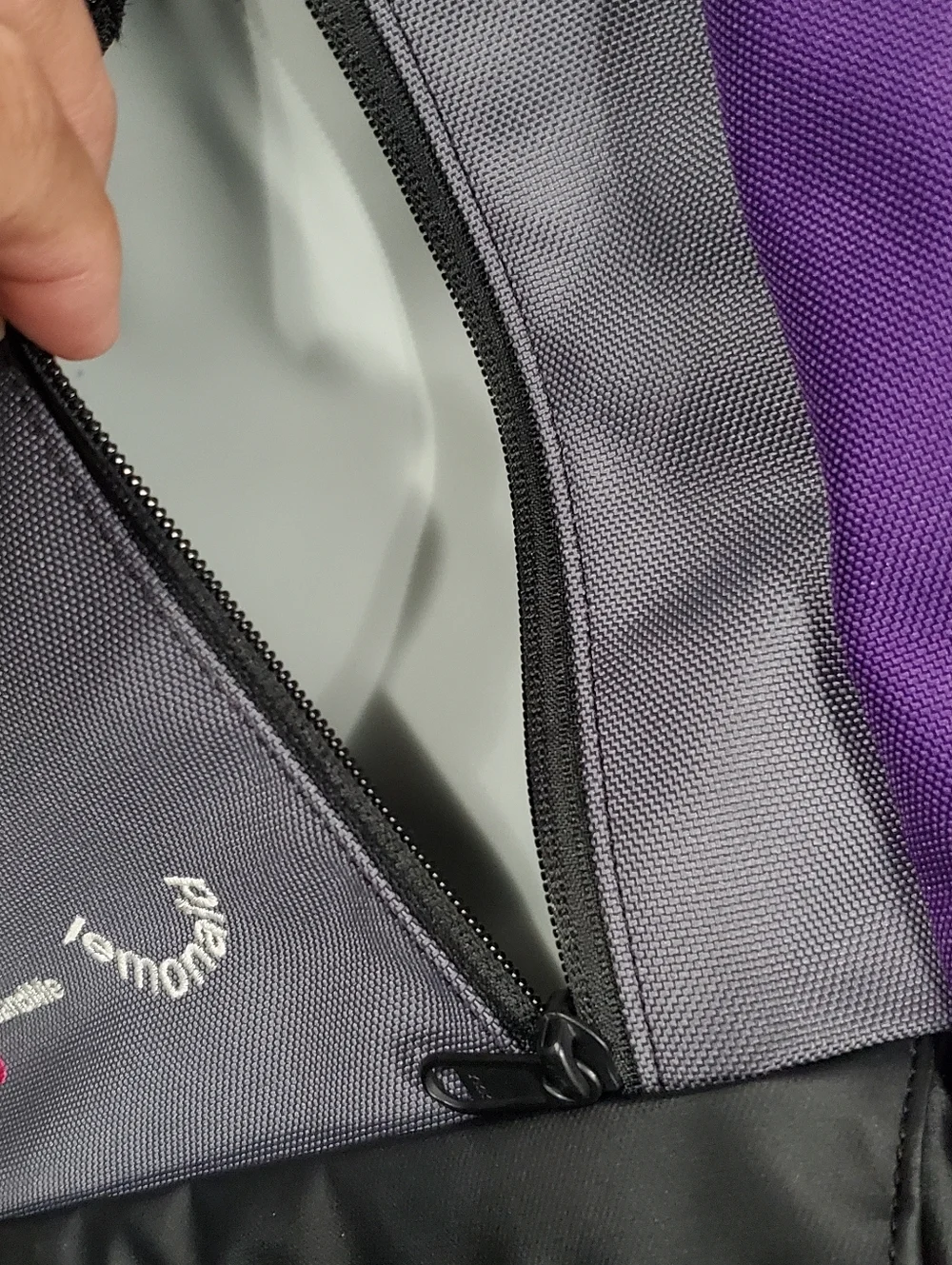 Timbuk2 Alcatraz Laptop Backpack, featuring branding from 23andMe and Lemonade